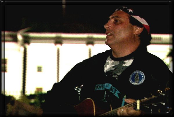 With the White House in the background, Craig asks "Who Hears The Cries"