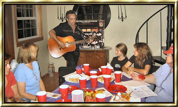 Members of "Voice For The Children" listen as Craig sings to celebrate the safe recovery of Angie.